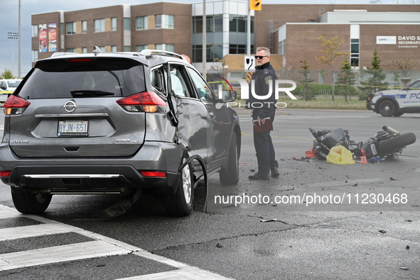 A Nissan Rogue and a motorcycle are at the crash site in Brampton, Ontario, Canada, on May 11, 2024. A motor vehicle crash involving these t...