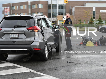 A Nissan Rogue and a motorcycle are at the crash site in Brampton, Ontario, Canada, on May 11, 2024. A motor vehicle crash involving these t...