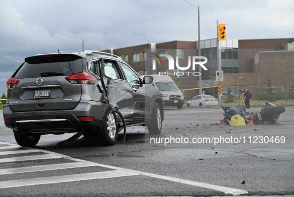 A Nissan Rogue and a motorcycle are at the crash site in Brampton, Ontario, Canada, on May 11, 2024. A motor vehicle crash involving these t...