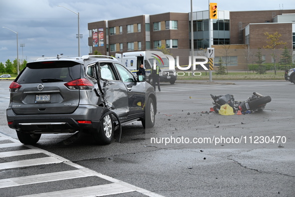 A Nissan Rogue and a motorcycle are at the crash site in Brampton, Ontario, Canada, on May 11, 2024. A motor vehicle crash involving these t...