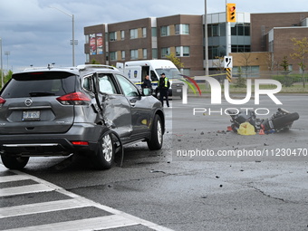 A Nissan Rogue and a motorcycle are at the crash site in Brampton, Ontario, Canada, on May 11, 2024. A motor vehicle crash involving these t...