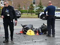 A motorcycle is at the crash site where a motor vehicle accident involving a Nissan Rogue and a motorcycle is leaving the motorcyclist in li...