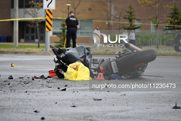 A motorcycle is at the crash site where a motor vehicle accident involving a Nissan Rogue and a motorcycle is leaving the motorcyclist in li...