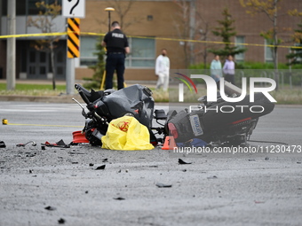 A motorcycle is at the crash site where a motor vehicle accident involving a Nissan Rogue and a motorcycle is leaving the motorcyclist in li...