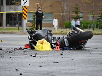 A motorcycle is at the crash site where a motor vehicle accident involving a Nissan Rogue and a motorcycle is leaving the motorcyclist in li...