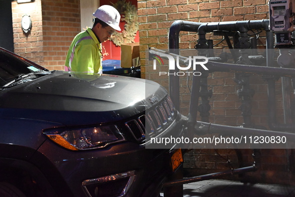 A vehicle is striking a home and possibly a gas meter in Toronto, Ontario, Canada, on May 11, 2024. Around 7:00 p.m. on Saturday evening, th...