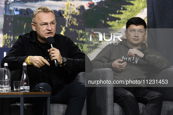 Mayor of Lviv Andriy Sadovyi (left) and Mykolaiv Regional Military Administration head Vitalii Kim (right) are attending the Second Internat...