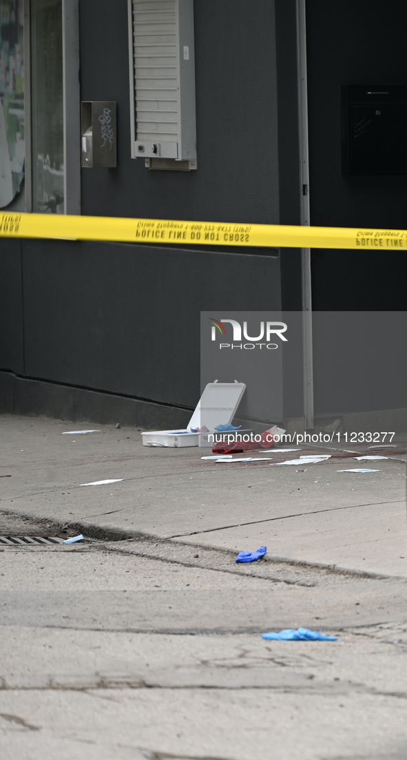 Police are responding to a slashing attack with evidence and blood visible on the ground in Toronto, Ontario, Canada, on May 12, 2024. They...