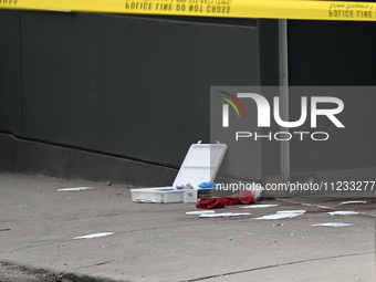 Police are responding to a slashing attack with evidence and blood visible on the ground in Toronto, Ontario, Canada, on May 12, 2024. They...