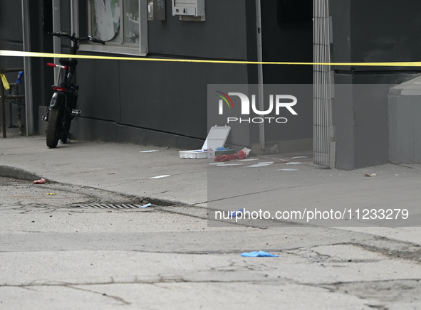 Police are responding to a slashing attack with evidence and blood visible on the ground in Toronto, Ontario, Canada, on May 12, 2024. They...