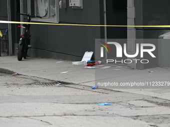 Police are responding to a slashing attack with evidence and blood visible on the ground in Toronto, Ontario, Canada, on May 12, 2024. They...