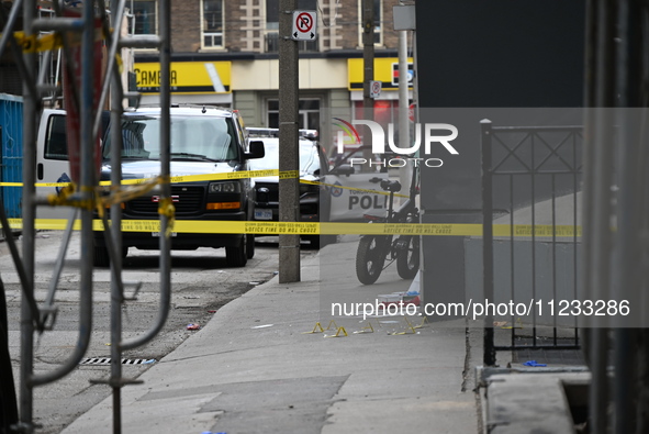 Evidence markers are at the scene of a slashing attack where evidence and blood have been discovered on the ground. Police are currently see...