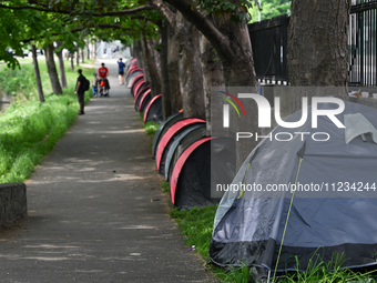 DUBLIN, IRELAND - MAY 12:
A new line of tents is pitched along one side of the Grand Canal by asylum seekers, on May 12, 2024, in Dubin, Ire...