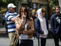 People are standing still as a siren sounds, marking Israel's Memorial Day, when the country commemorates fallen soldiers of Israel's wars a...