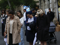 People are standing still as a siren sounds, marking Israel's Memorial Day, when the country commemorates fallen soldiers of Israel's wars a...