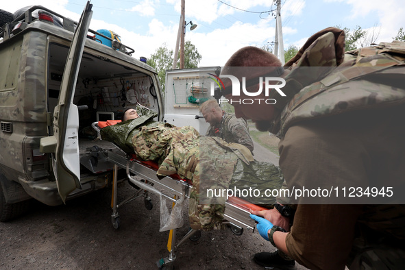 A wounded person is being evacuated from the city of Vovchansk, which is constantly subjected to Russian shelling, in the Kharkiv region, no...