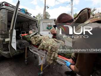 A wounded person is being evacuated from the city of Vovchansk, which is constantly subjected to Russian shelling, in the Kharkiv region, no...