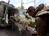 A wounded person is being evacuated from the city of Vovchansk, which is constantly subjected to Russian shelling, in the Kharkiv region, no...