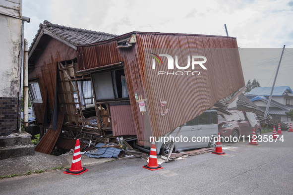 Collapsed houses and damaged cars are seen in the eastern Kumamoto suburb of Mashiki and neighboring areas, one month after a series of deva...