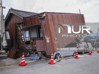 Collapsed houses and damaged cars are seen in the eastern Kumamoto suburb of Mashiki and neighboring areas, one month after a series of deva...