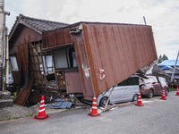 Collapsed houses and damaged cars are seen in the eastern Kumamoto suburb of Mashiki and neighboring areas, one month after a series of deva...