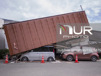 Collapsed houses and damaged cars are seen in the eastern Kumamoto suburb of Mashiki and neighboring areas, one month after a series of deva...