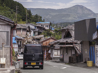 Collapsed houses and damaged cars are seen in the eastern Kumamoto suburb of Mashiki and neighboring areas, one month after a series of deva...