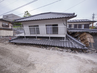 Collapsed houses are seen one month after a series of devastating earthquakes struck the eastern Kumamoto suburb of Mashiki and neighboring...