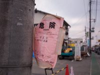 ''Unsafe'' notices are being placed on every damaged building in Mashiki, Kumamoto, Japan, on May 21, 2016, one month after a series of deva...