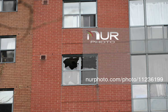 A broken window is visible at the apartment unit where a fire is currently under investigation. The fire, which broke out in Etobicoke, Toro...