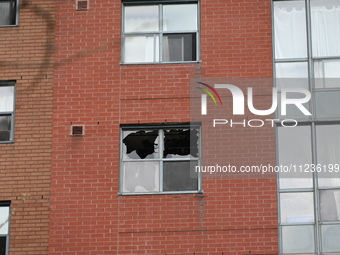 A broken window is visible at the apartment unit where a fire is currently under investigation. The fire, which broke out in Etobicoke, Toro...