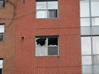 A broken window is visible at the apartment unit where a fire is currently under investigation. The fire, which broke out in Etobicoke, Toro...