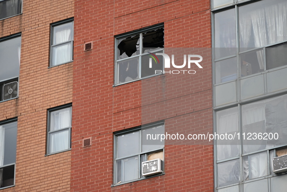 A broken window is visible at the apartment unit where a fire is currently under investigation. The fire, which broke out in Etobicoke, Toro...