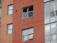 A broken window is visible at the apartment unit where a fire is currently under investigation. The fire, which broke out in Etobicoke, Toro...