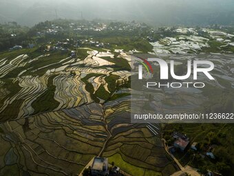 Villagers are working in a terraced field in Shiyuan village of Bijie city, Southwest China's Guizhou province, on May 13, 2024. (