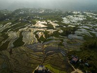 Villagers are working in a terraced field in Shiyuan village of Bijie city, Southwest China's Guizhou province, on May 13, 2024. (