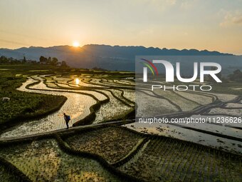 Villagers are working in a terraced field in Shiyuan village of Bijie city, Southwest China's Guizhou province, on May 13, 2024. (