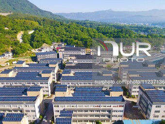 Photovoltaic panels are being seen on the roofs of enterprises in Lianyun township, Anqing city, Anhui province, China, on May 14, 2024. (