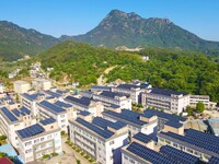 Photovoltaic panels are being seen on the roofs of enterprises in Lianyun township, Anqing city, Anhui province, China, on May 14, 2024. (