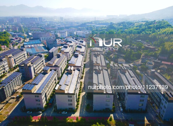 Photovoltaic panels are being seen on the roofs of enterprises in Lianyun township, Anqing city, Anhui province, China, on May 14, 2024. 