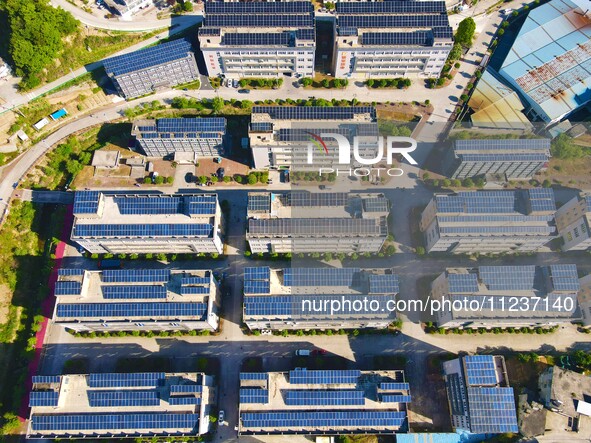 Photovoltaic panels are being seen on the roofs of enterprises in Lianyun township, Anqing city, Anhui province, China, on May 14, 2024. 