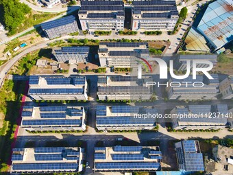 Photovoltaic panels are being seen on the roofs of enterprises in Lianyun township, Anqing city, Anhui province, China, on May 14, 2024. (