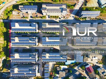 Photovoltaic panels are being seen on the roofs of enterprises in Lianyun township, Anqing city, Anhui province, China, on May 14, 2024. (