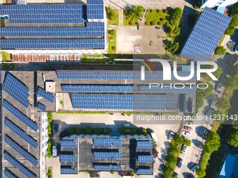 Photovoltaic panels are being seen on the roofs of enterprises in Lianyun township, Anqing city, Anhui province, China, on May 14, 2024. (