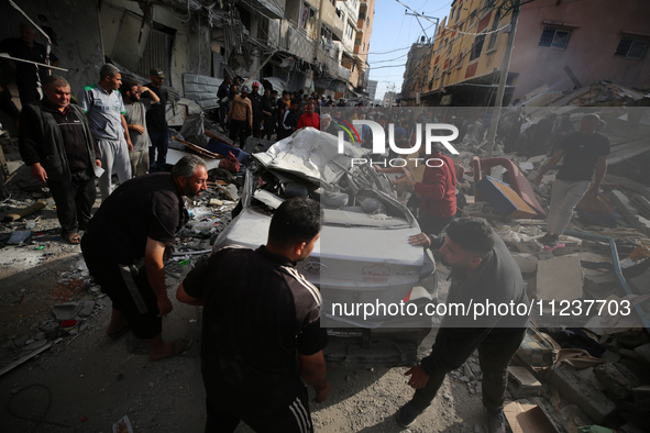 A Palestinian man is reacting as he searches for casualties at the site of an Israeli strike on a house, amid the ongoing conflict between I...