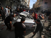 A Palestinian man is reacting as he searches for casualties at the site of an Israeli strike on a house, amid the ongoing conflict between I...