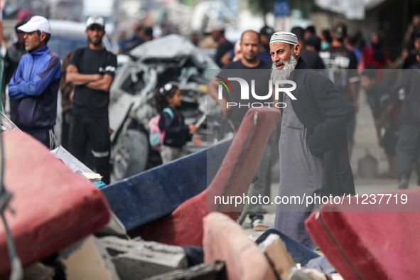 A Palestinian man is reacting as he searches for casualties at the site of an Israeli strike on a house, amid the ongoing conflict between I...