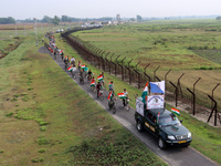 Indian Border Security Force (BSF) personnel, along with the youths, are taking part in a cycle awareness rally at the India-Bangladesh bord...