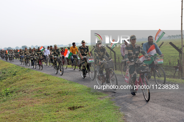 Indian Border Security Force (BSF) personnel, along with the youths, are taking part in a cycle awareness rally at the India-Bangladesh bord...