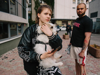 People whose homes are being damaged by an airstrike  in Kharkiv, Ukraine, on May 14, 2024. Russia struck Kharkiv with guided aerial bombs....